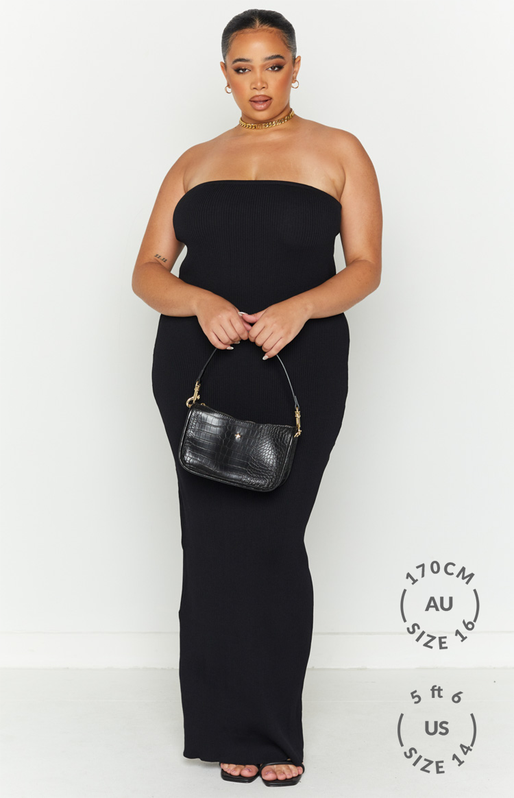 Full length view of a black ribbed knit strapless maxi dress with a straight hem