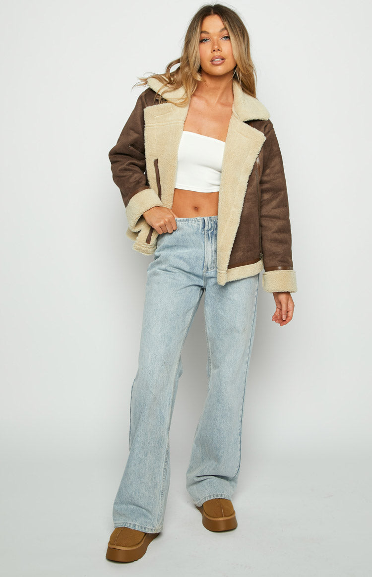 Brown sherpa jacket with cream lining, wide lapels, and a slightly cropped, open front