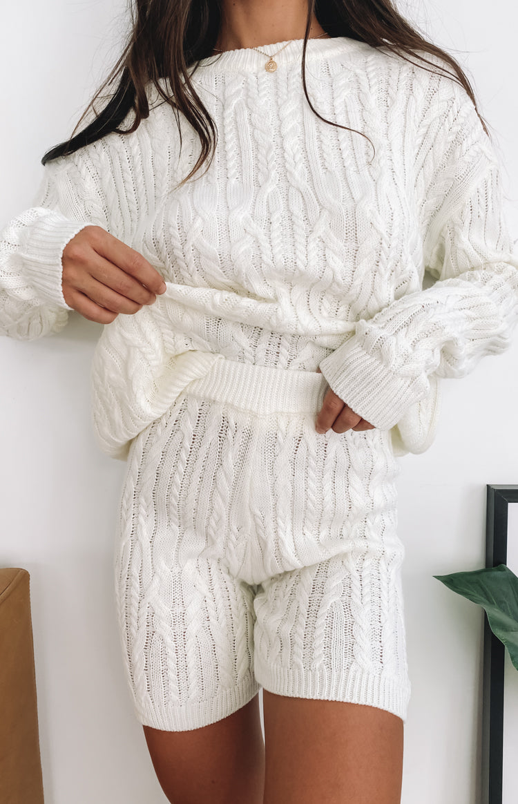 Cream cable knit sweater and shorts set with a crew neck, ribbed cuffs, and elasticated waistband