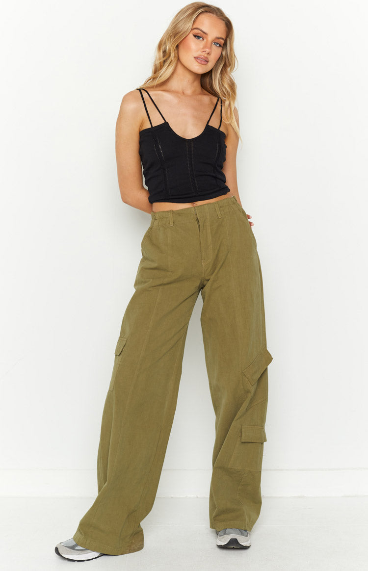Black knit crop top with a deep V-neckline, double spaghetti straps, and textured vertical seam details