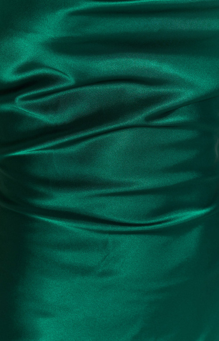 Emerald green satin dress fabric with a smooth, shimmering texture and gentle folds