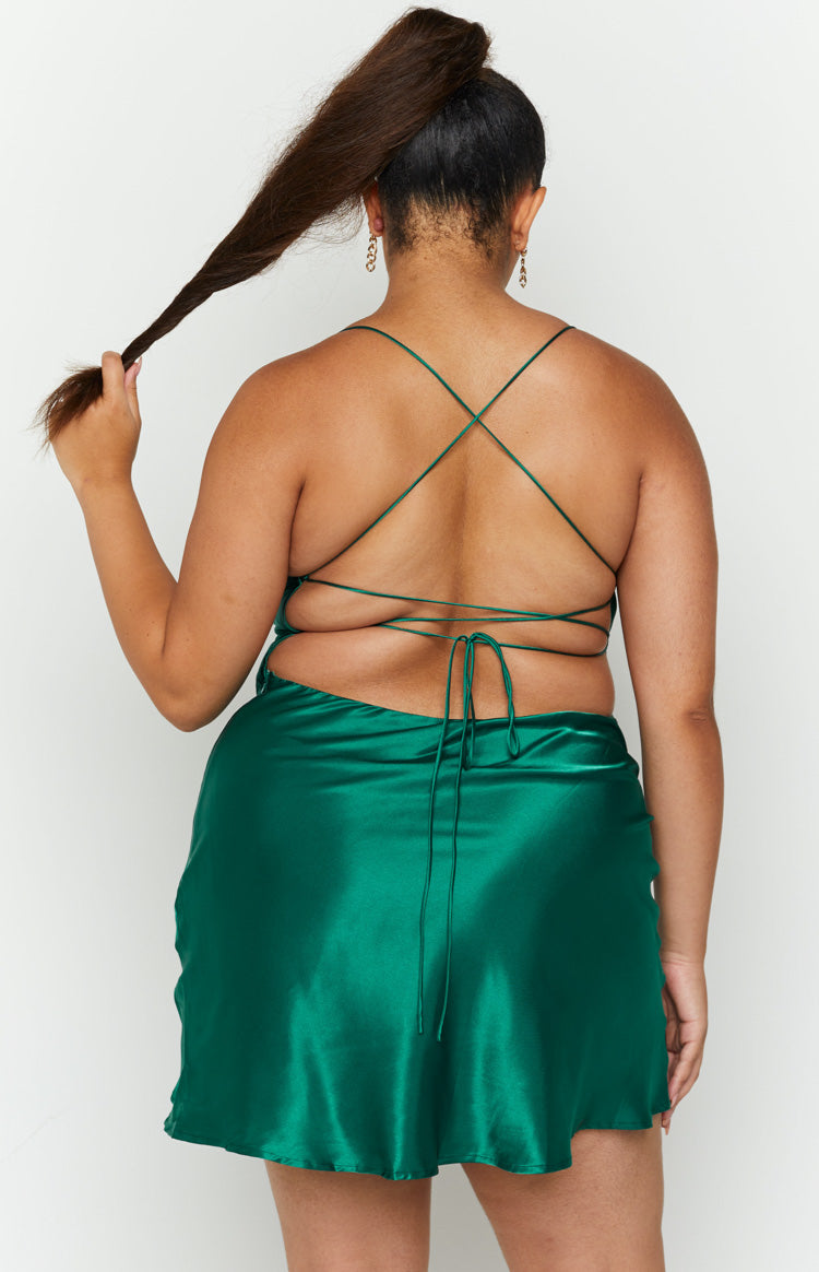 Emerald satin party dress featuring a cowl back and thin criss-cross tie-up straps