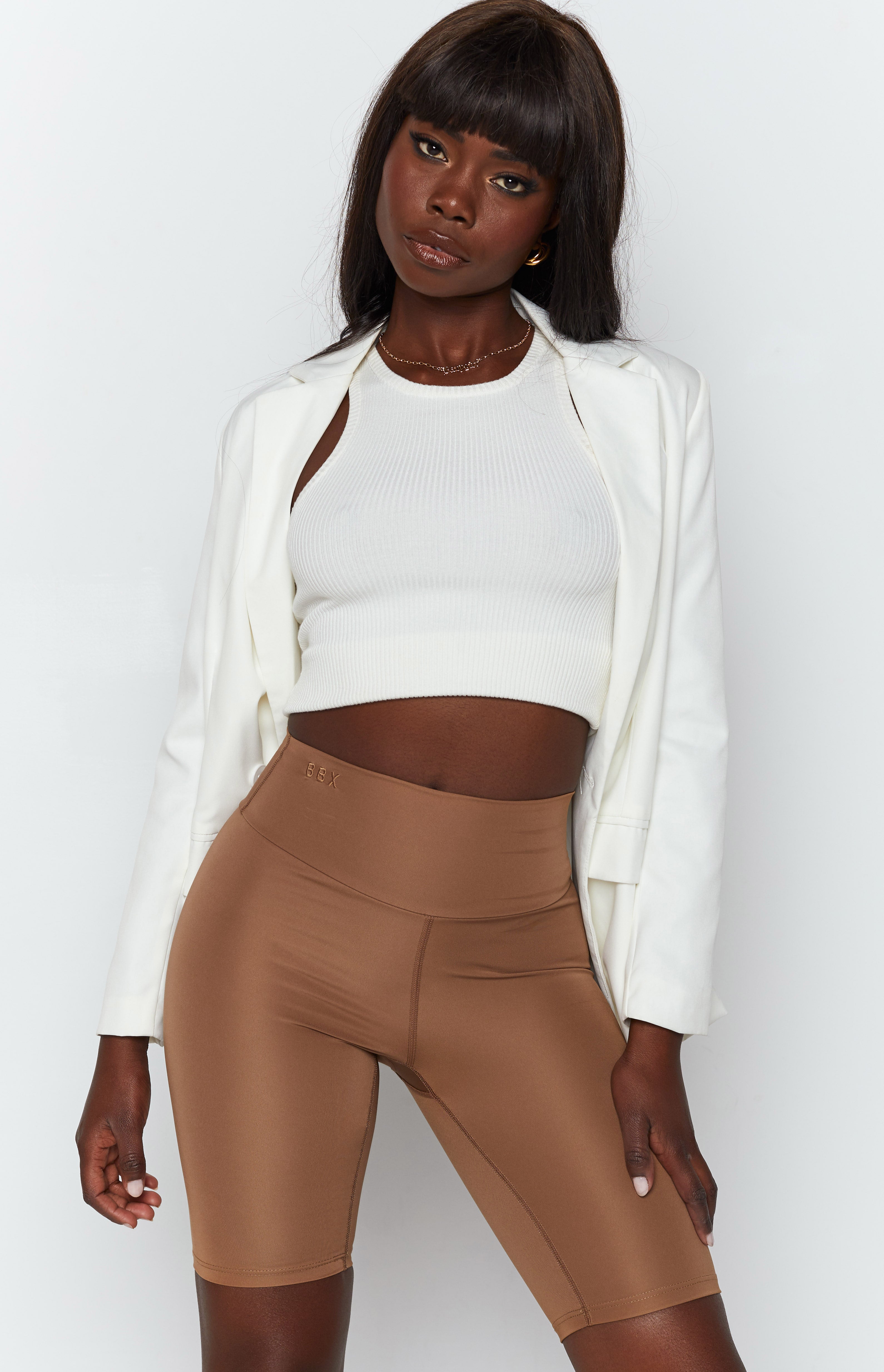 Toffee Dash Bike Shorts, high-waisted with a bodycon fit, mid-thigh length, and BBX logo on the waistband