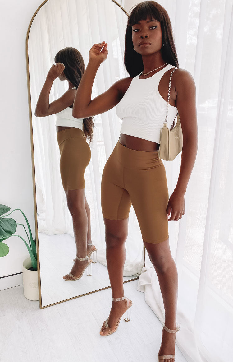 Toffee high-waisted bike shorts with a smooth, wide waistband and mid-thigh length