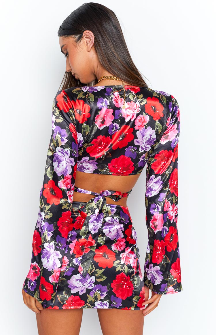 Rear view of the black satin floral top with red and purple flowers, featuring a cut-out back and tie closure