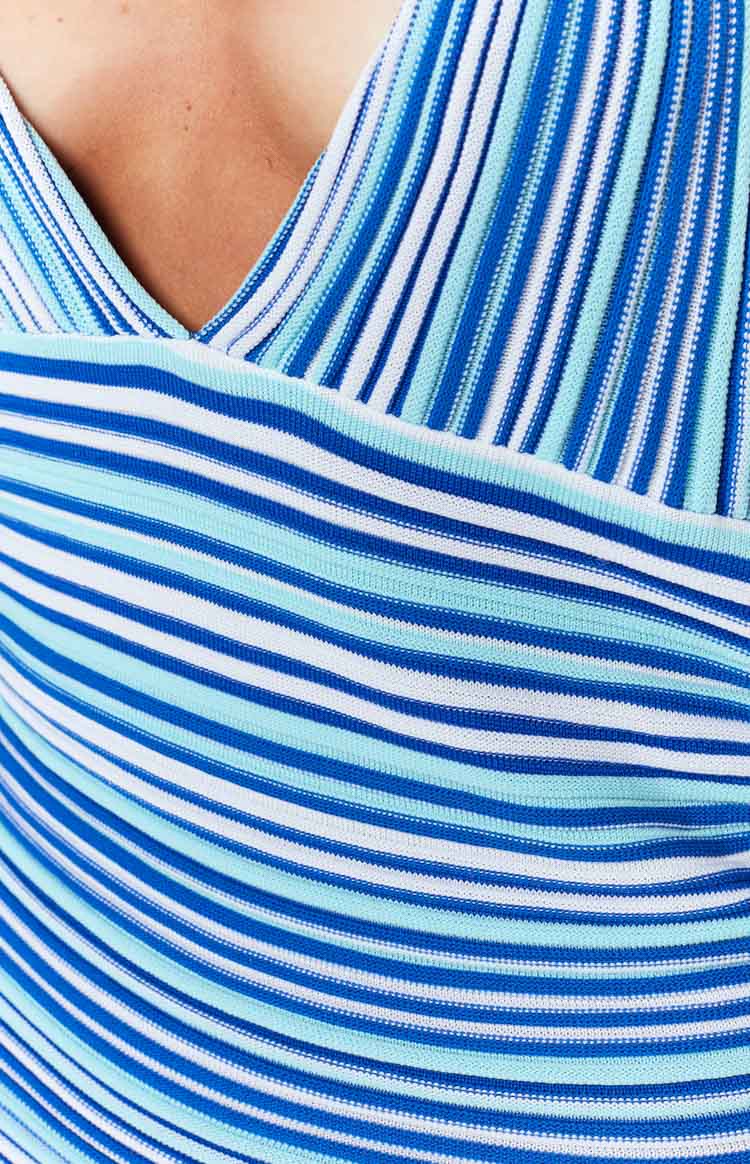 Close-up of the blue, white, and light blue striped knit V-neckline and horizontal bodice pattern