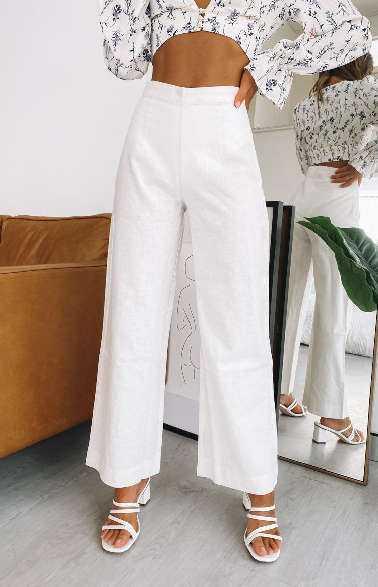 White linen high-waisted wide-leg pants with a relaxed fit and full length