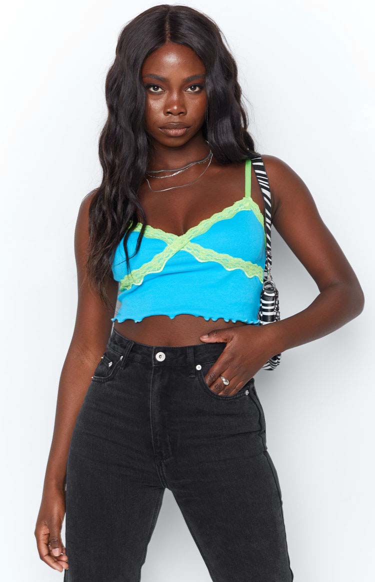 Blue ribbed knit crop tank top with lime green lace trim V-neckline and crossover bust detail, scalloped hem