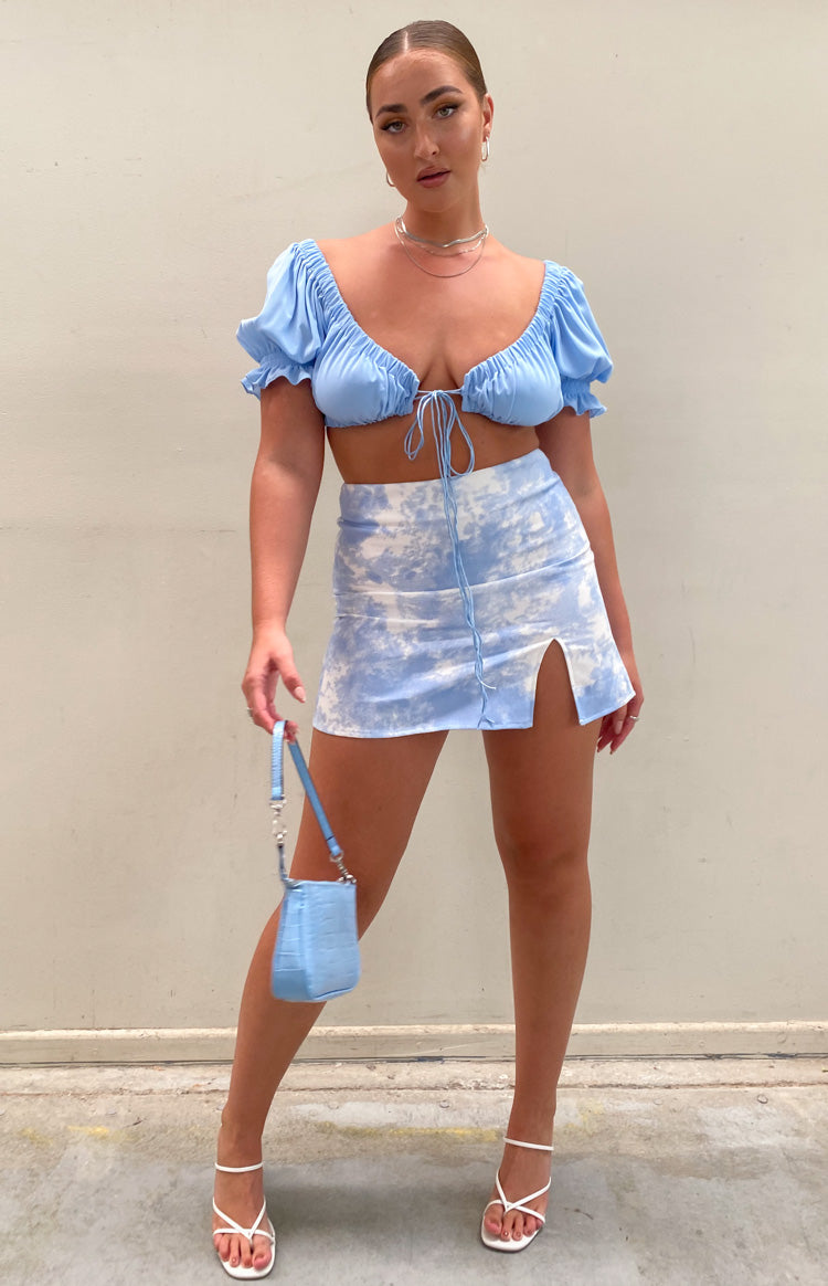 Light blue and white tie-dye denim mini skirt with a front drawstring and side thigh slit