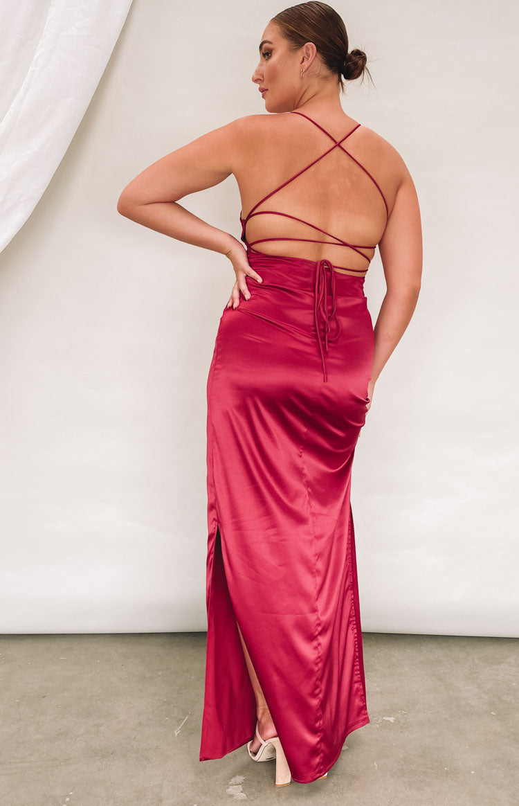 Wine satin formal dress with a low open back, criss-cross straps, tie detail, and a high side slit