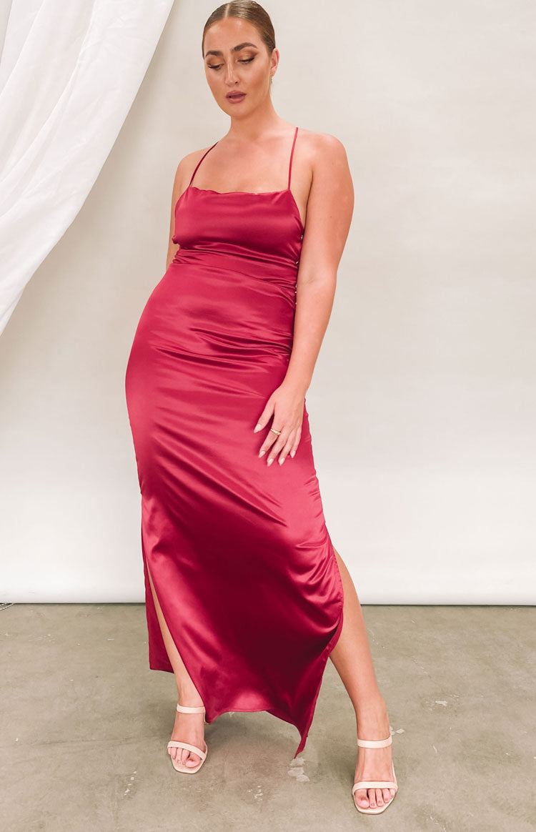 Wine satin maxi dress with square neckline, thin spaghetti straps, high side split, and ruched detail