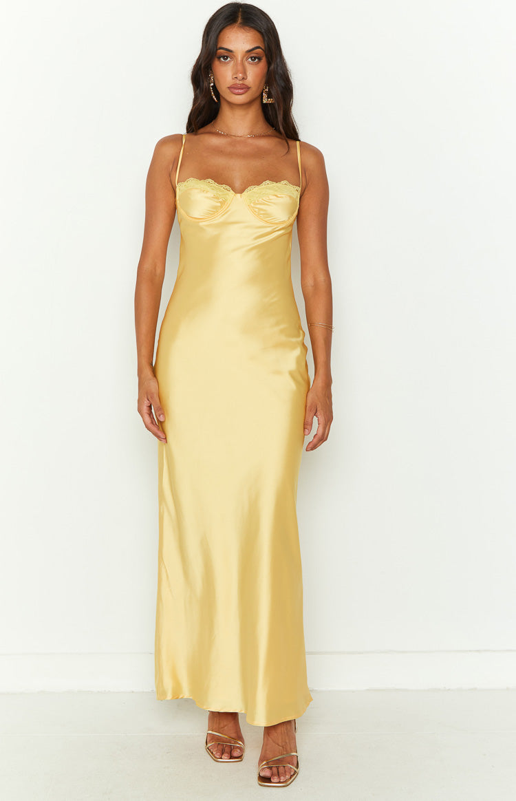 Yellow satin midi dress with a lace-trimmed bust, delicate spaghetti straps, and a fluid silhouette