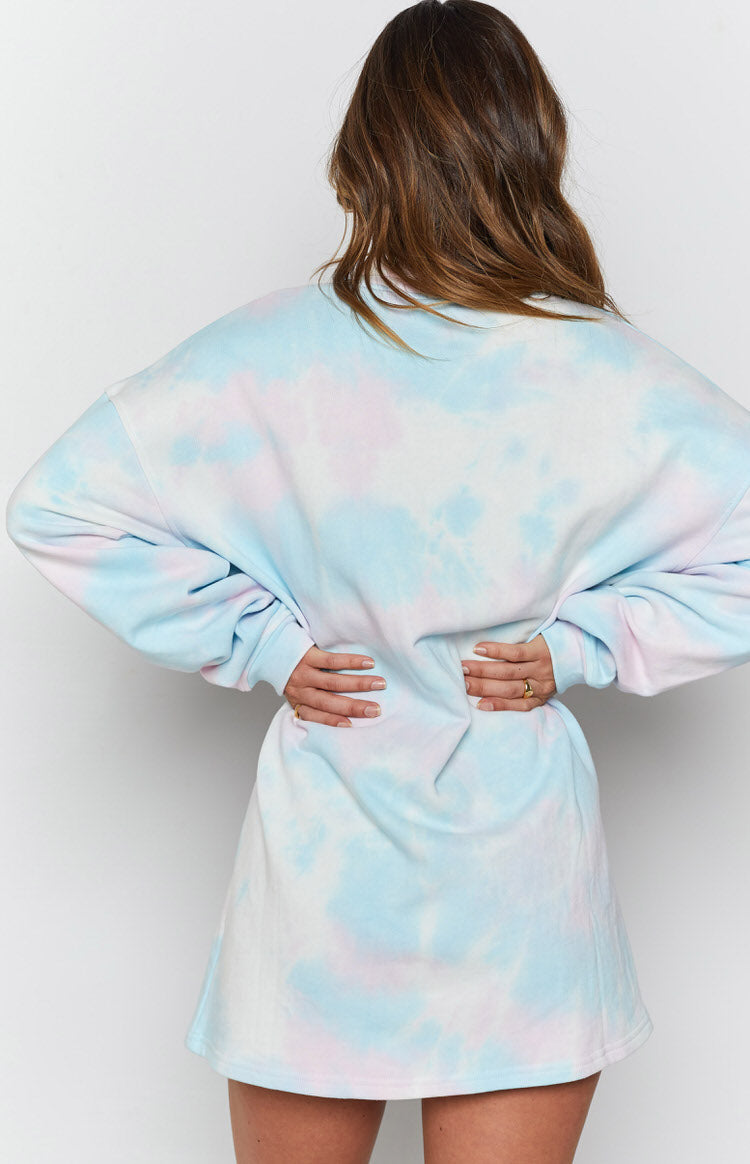 Back view of a pastel blue and pink tie-dye sweater dress with long cuffed sleeves and relaxed fit