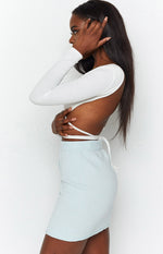 Light blue soft knit mini skirt with a close-fitting silhouette