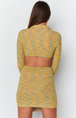Fitted yellow, orange, blue variegated knit mini dress with a collared back, long sleeves, and wide cutout