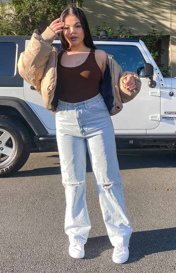 Light blue wash wide leg jeans with ripped knees