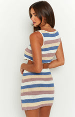 Side view of a fitted striped crochet mini skirt with white, blue, beige, and mauve horizontal stripes