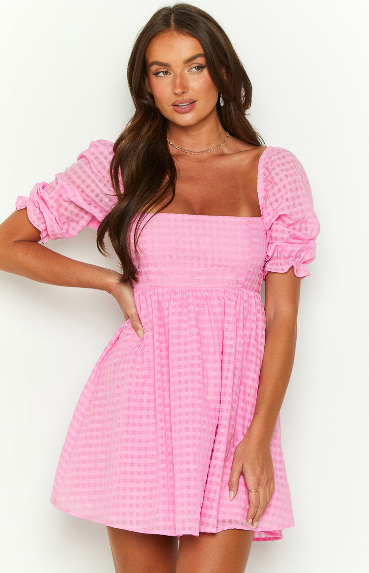 Pink textured check babydoll mini dress with square neckline, puff sleeves, and gathered waist