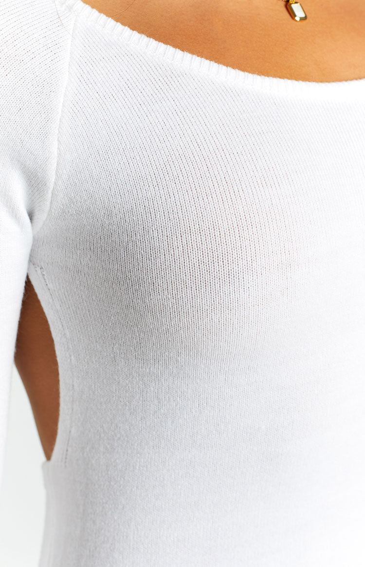 Detail of the white knit dress with a square neckline and a side cutout design