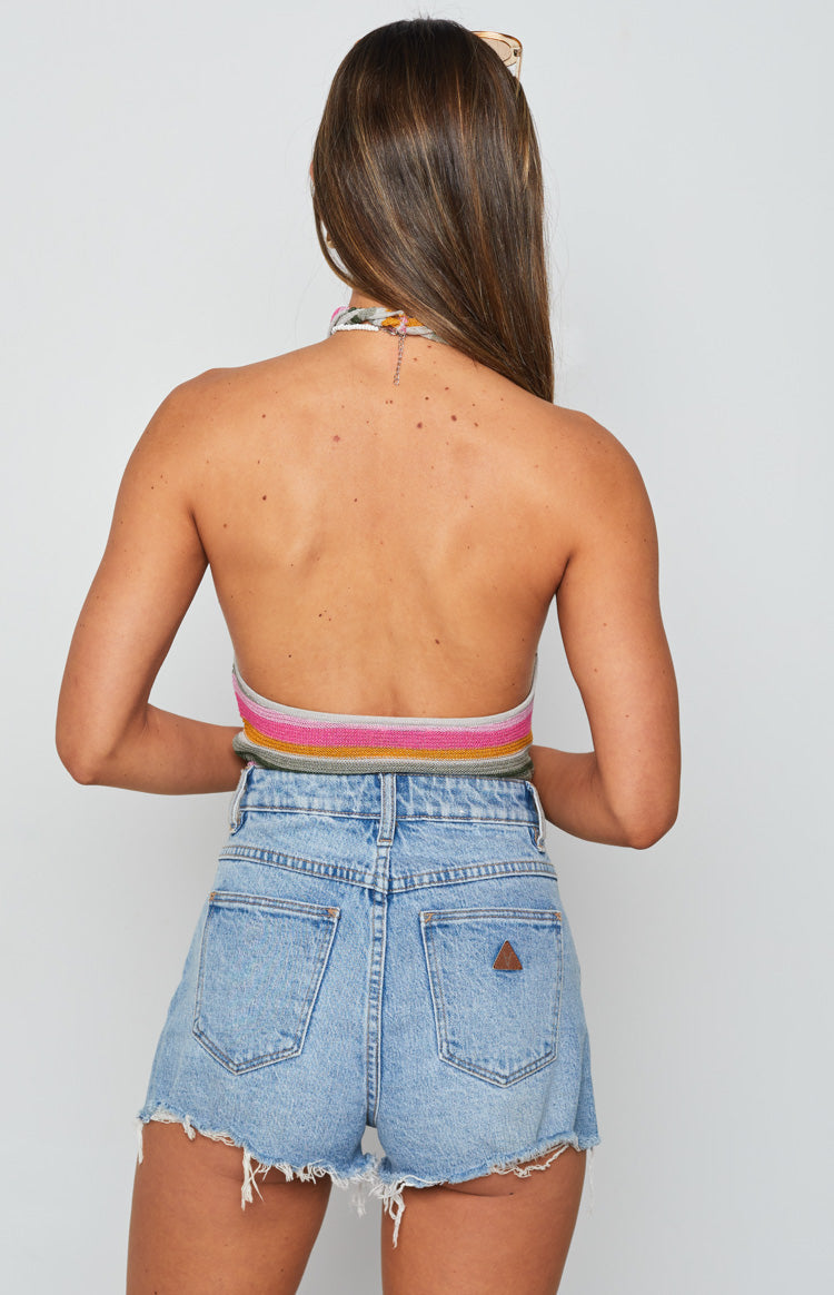Rear view of the multi-coloured striped knit halter top with an open back and tie neck