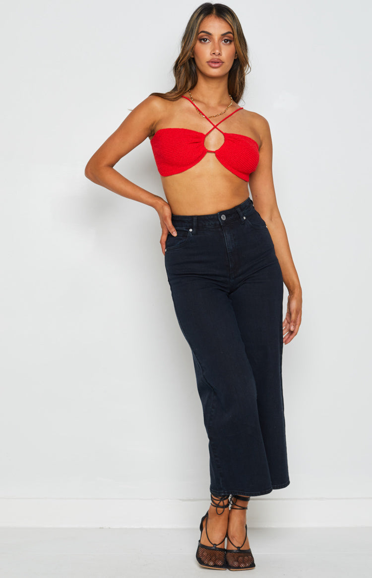 Red textured halter crop top with criss-cross straps and a front circular cutout