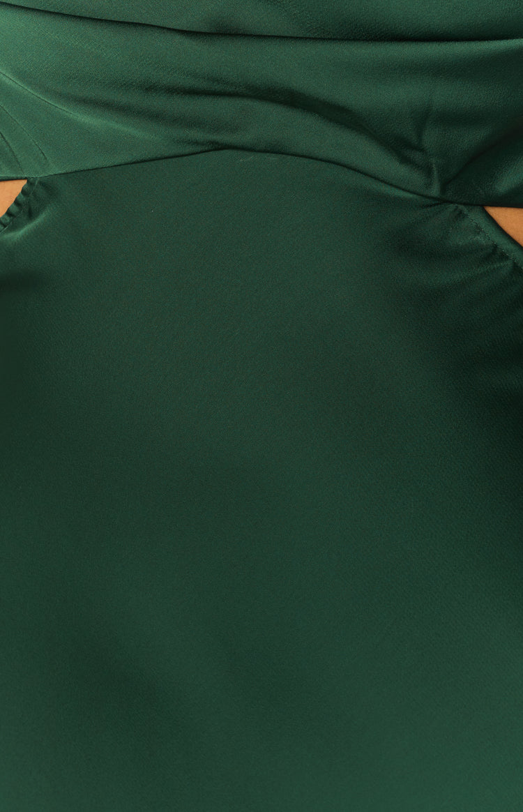 Dark green dress with a draped bodice and an angled side cut-out