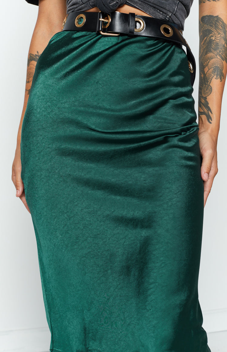 Emerald green midi skirt in a textured satin fabric, showcasing its smooth drape and subtle sheen