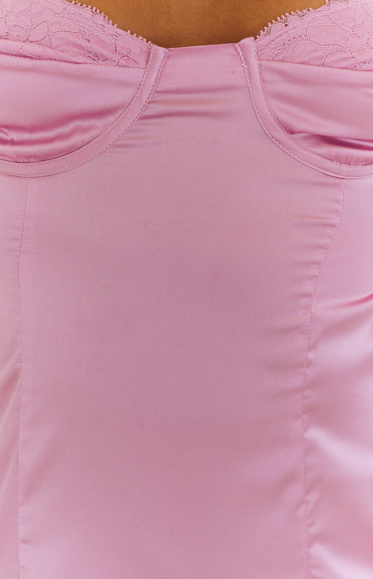 Close-up of the pink satin bustier bodice with lace trim and visible cup stitching