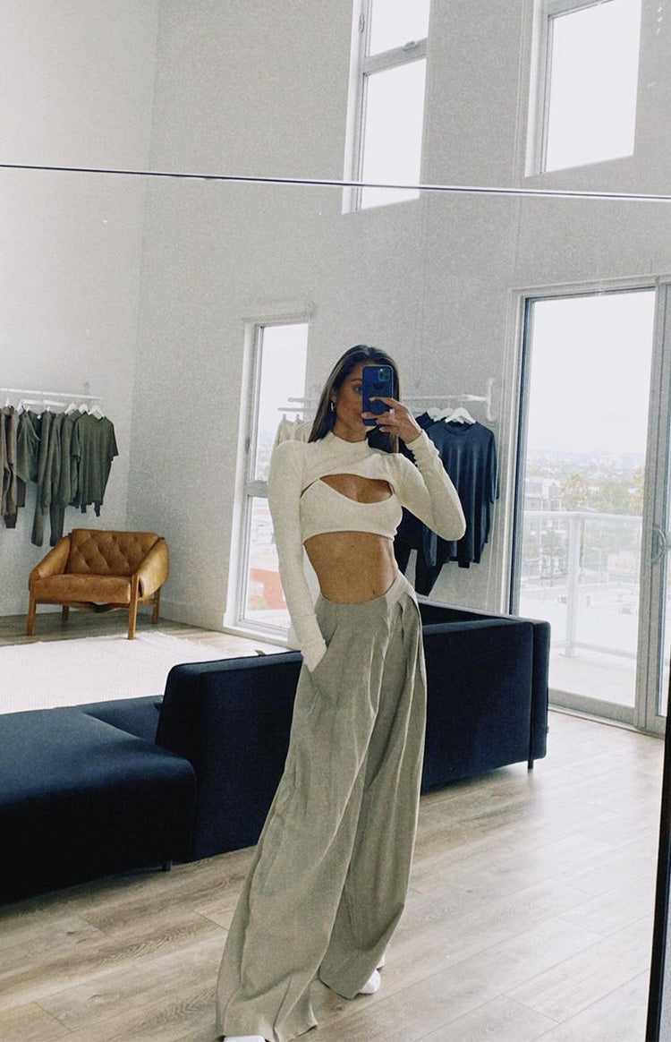 Cream ribbed high neck long sleeve crop top with a wide chest cutout
