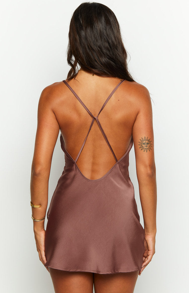 Rear view of a brown slip mini dress with a low scoop back and criss-cross spaghetti straps