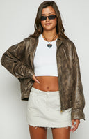 Vintage lioness chocolate bomber jacket on blonde model.